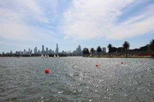 The view from the middle of the circuit on Albert Park Lake, looking back towards the Melbourne city skyline. The track (Lakeside Drive for most of the year) follows the Eastern shore away to the right.