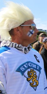A Finnish fan in the crowd cheers on his countrymen in his national colours.