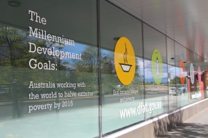 The exterior of one of the Department of Foreign Affairs buildings portrays the goals of the Australian Aid program.