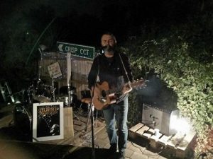 Newcastle's Jamie Hay playing in a Lyneham backyard for No Fron Fences 2017