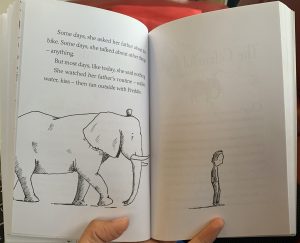 Book with illustration of Elephant and man